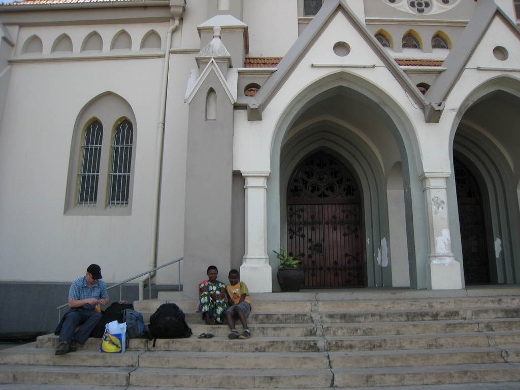 006-hiding-from-touts-on-church-steps.jpg